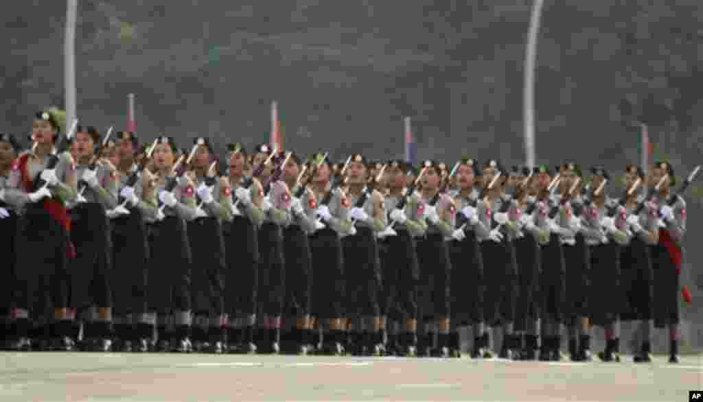 Myanmar female soldiers march during a ceremony to mark the 67th anniversary of the country's Independence Day in Naypyitaw, Myanmar, Sunday, Jan. 4, 2015. (AP Photo/Khin Maung Win)