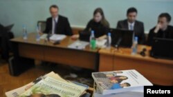 FILE - Stacks of booklets distributed by members of Jehovah's Witnesses are seen during the court session in the Siberian town of Gorno-Altaysk, Dec. 16, 2010. 