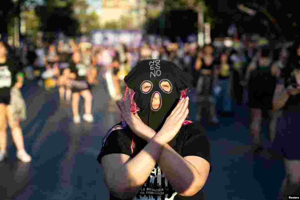 A woman participates in a protest to mark the International Day for the Elimination of Violence Against Women, in Santiago, Chile, Nov. 25, 2024. 