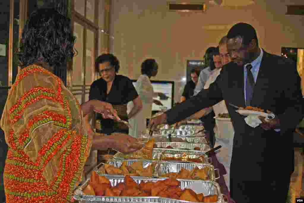 Swahili Service employees serve food during Swahili Service 50th Anniversary Celebration.