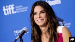 FILE - Actress Sandra Bullock speaks to the press at the Toronto International Film Festival, in Toronto, Canada, Sept. 9, 2013.