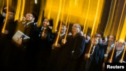 Participants of the Conference of European Rabbis carry candles as they commemorate the 75th anniversary of Kristallnacht in front of Brandenburg Gate in Berlin, early November 12, 2013. 