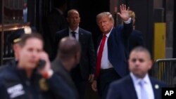 Former President Donald Trump waves to supporters upon arriving at Trump Tower, Monday, April 3, 2023, in New York. 