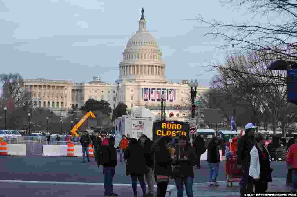 Security is high ahead of Friday's presidential inauguration in Washington, D.C., Jan. 19, 2017. Tourists walk through streets that have been blocked near the U.S. Capitol.