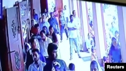A suspected suicide bomber enters St Sebastian's Church in Negombo, Sri Lanka, April 21, 2019 in this still image taken from a CCTV handout footage of Easter Sunday attacks released on Apr. 23, 2019. (CCTV/Siyatha News via Reuters) 