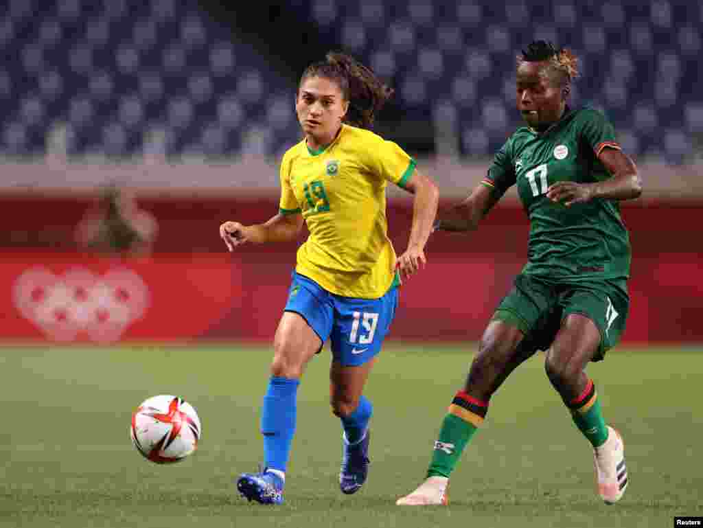 Leticia Santos of Brazil in action with Racheal Kundanaji of Zambia REUTERS/Molly Darlington