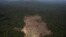 FILE - This aerial view shows a tract of Amazon jungle recently cleared by loggers and farmers near the city of Novo Progresso, Para state, Brazil, Sept. 22, 2013.