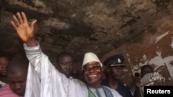 Sierra Leone's incumbent President Ernest Bai Koroma waves to supporters after voting in the capital, Freetown, November 17, 2012.