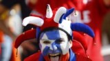 A Chilean fan poses for the camera before the start of the match against Netherlands at the Corinthians arena in Sao Paulo, June 23, 2014.