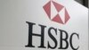 FILE - A sign for the British bank and financial services giant HSBC.