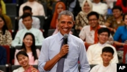 U.S. President Barack Obama smiles as he takes questions from the floor at the Young Southeast Asian Leaders Initiative (YSEALI) town hall meeting at Taylor's University in Kuala Lumpur, Malaysia, Nov. 20, 2015.