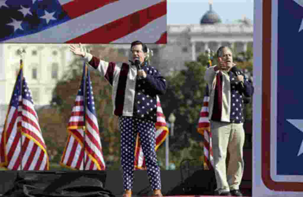 Comedians Stephen Colbert, left, and Jon Stewart perform during their Rally to Restore Sanity and/or Fear on the National Mall in Washington, Saturday, Oct. 30, 2010. The "sanity" rally blending laughs and political activism drew thousands to the mall wi
