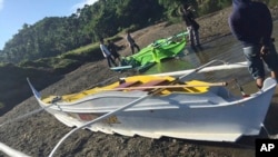 This undated photo provided by the Armed Forces of the Philippines, shows boats the military said were used by Abu Sayyaf militants to enter the Ibananga River in the central Philippines, April 12, 2017.