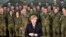 FILE - German chancellor Angela Merkel visits soldiers with the German Army medical service in Leer, northern Germany, Dec. 7, 2015. Germany's parliament voted last week to send military support in the fight against Islamic State militants in Syria. 