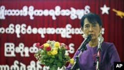 Burma's pro-democracy leader Aung San Suu Kyi speaks at a ceremony to welcome and acknowledge released political prisoners at the National League for Democracy head office in Rangoon, Burma, May 27, 2011
