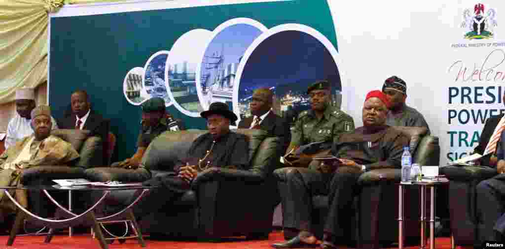 (Front seated, from L to R) Nigeria's Vice President Namadi Sambo, President Goodluck Jonathan and Secretary to the Government of the Federation (SGF) Anyim Pius Anyim attend the opening of the Presidential Power Reform Transaction signing summit.