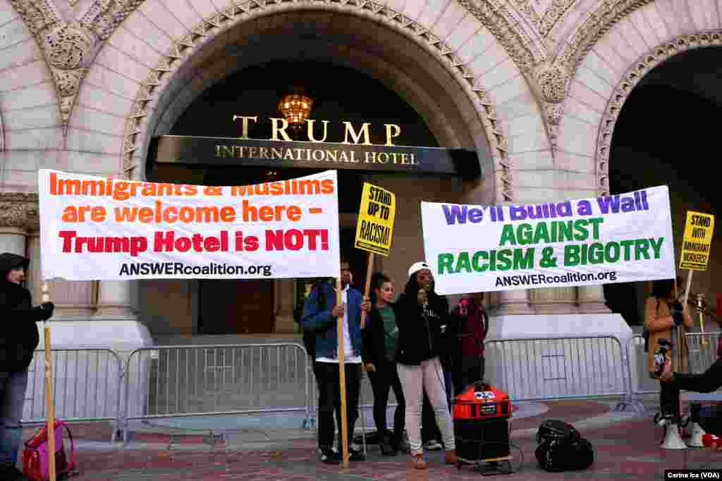 Hundreds protest Donald Trump at the opening of the International Trump Hotel at the Old U.S. Post Office Building in Washington, D.C. Trump was in town for the ribbon-cutting for the luxury hotel, less than two weeks before election day on November 8.