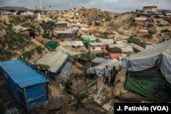 Refugee shelters are packed onto steep hillsides in the Bulukhali camp in southeastern Bangladesh. May and June bring cyclones and monsoons, and aid groups warn of landslides, floods, and disease outbreaks in the refugee camps.
