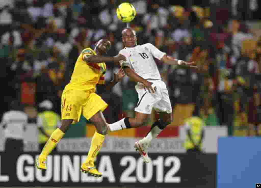 Ghana's Ayew Andre Morgan Rami (R) challenges Diakite Drissa of Mali during their African Cup of Nations Group D soccer match in FranceVille Stadium January 28, 2012.