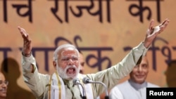 India's Prime Minister Narendra Modi addresses his supporters at Bharatiya Janata Party (BJP) headquarters in New Delhi, India, March 12, 2017. 