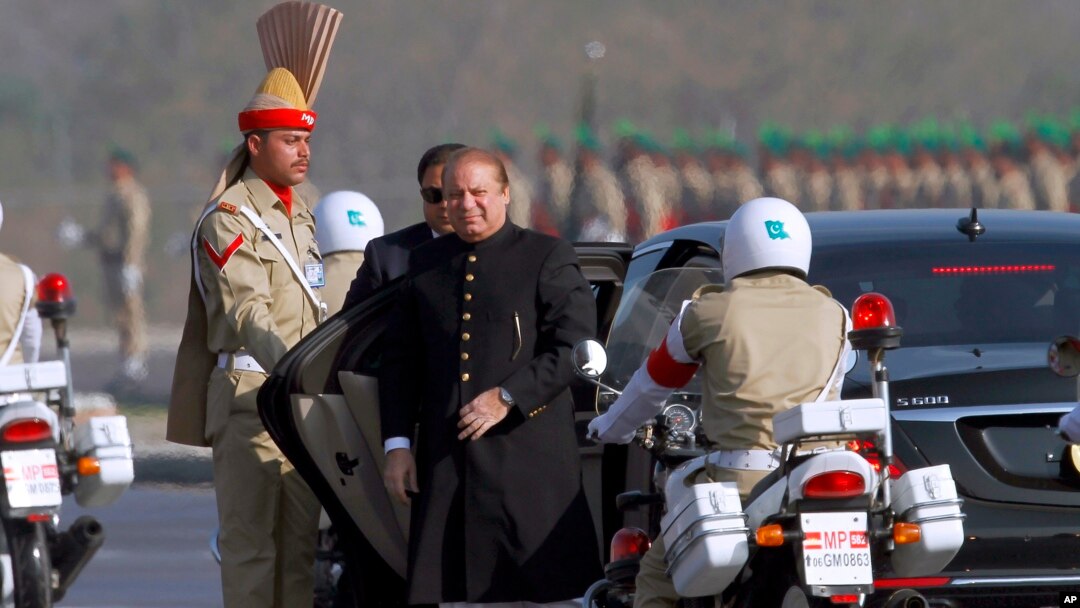 FILE - Pakistan's prime minister Nawaz Sharif, center, arrives to attend a military parade to mark Pakistan's Republic Day, in Islamabad, Pakistan, Thursday, March 23, 2017.
