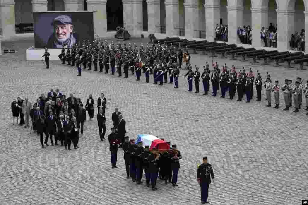 Republican Guards carry the coffin of Jean-Paul Belmondo after a tribute ceremony for the late French actor at the Hotel des Invalides in Paris, France.