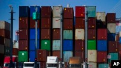 FILE - Containers are stacked at the Port of Long Beach in California, Oct. 1, 2021. 