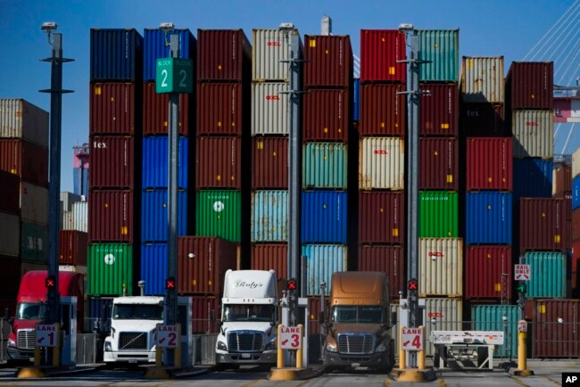 FILE - Containers are stacked at the Port of Long Beach in California, Oct. 1, 2021.