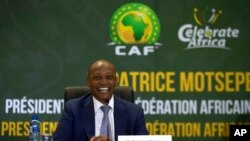 FILE - CAF President Patrice Motsepe smiles during a news conference in Johannesburg, South Africa, March 16, 2021. 