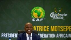 FILE - CAF President Patrice Motsepe smiles during a news conference in Johannesburg, South Africa, March 16, 2021.