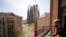 FILE - Amateur pianist Alberto Gestoso Arce, 37, plays the piano from his balcony for neighbours, near the Sagrada Familia basilica, during the coronavirus disease (COVID-19) outbreak in Barcelona, Spain, March 21, 2020. 