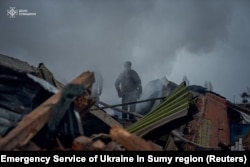 Firefighters enactment    astatine  the tract  of a Russian subject   strike, amid Russia's onslaught  connected  Ukraine, successful  Sumy, Ukraine November 26, 2024. (Press work  of the State Emergency Service of Ukraine successful  Sumy region/Handout via Reuters)