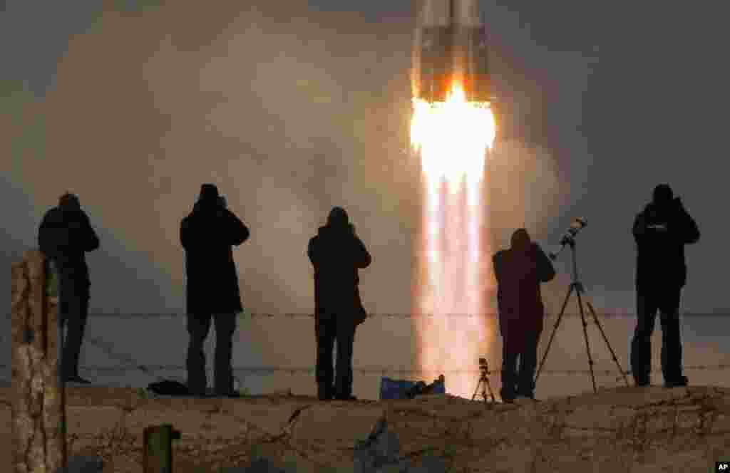 The Soyuz-FG rocket booster with Soyuz TMA-19M space ship carrying a new crew to the International Space Station, ISS, blasts off at the Russian-leased Baikonur cosmodrome, Kazakhstan.