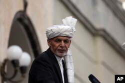 FILE - Afghan President Ashraf Ghani speaks after he was sworn in at an inauguration ceremony at the presidential palace in Kabul, March 9, 2020.