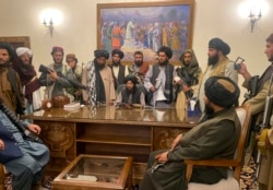 Taliban fighters take control of Afghan presidential palace after the Afghan President Ashraf Ghani fled the country, in Kabul, Afghanistan, Sunday, Aug. 15, 2021. (AP Photo/Zabi Karimi)