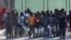 Migrants are seen after disembarking a rescue boat at the port of Malaga, southern Spain, Sept. 23, 2018. 