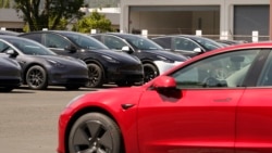 In this April 2, 2021 file photo new electric cars are parked at a Tesla delivery location and service center in Corte Madera, Calif. (AP Photo/Eric Risberg, file)
