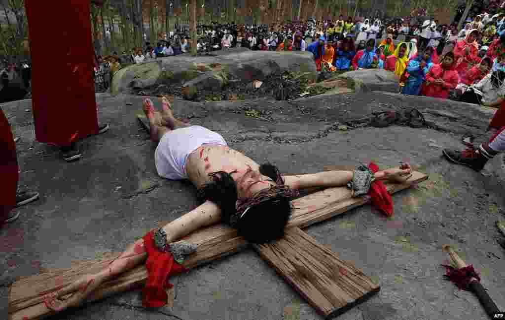 A devotee enacts the crucifixion of Jesus Christ to mark Good Friday in Gauhati, India. (AP)