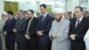 Assad Appears in Public for Eid Prayers