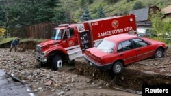 A rescue vehicle is seen stuck in the mud in Jamestown, Colorado, after a flash flood destroyed much of the town, September 14, 2013.