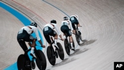 Members of the German men's track cycling team round the track during a training session inside the Izu velodrome at the 2020 Summer Olympics, July 29, 2021, in Tokyo, Japan.