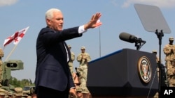 U.S. Vice President Mike Pence addresses servicemen participating in the Noble Partner 2017 joint multinational military exercises outside Tbilisi, Georgia, Tuesday, Aug. 1, 2017.