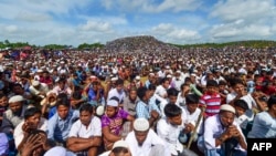 FILE - Rohingya refugees attend a ceremony to mark the second anniversary of the exodus at the Kutupalong refugee camp in Ukhia, August 25, 2019. 