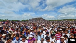 FILE - Rohingya refugees attend a ceremony to mark the second anniversary of the exodus at the Kutupalong refugee camp in Ukhia, Aug. 25, 2019.