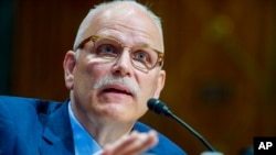FILE - Chris Magnus testifies before the Senate Finance Committee on his nomination to be the U.S. Customs and Border Protection commissioner, Oct. 19, 2021, on Capitol Hill in Washington.