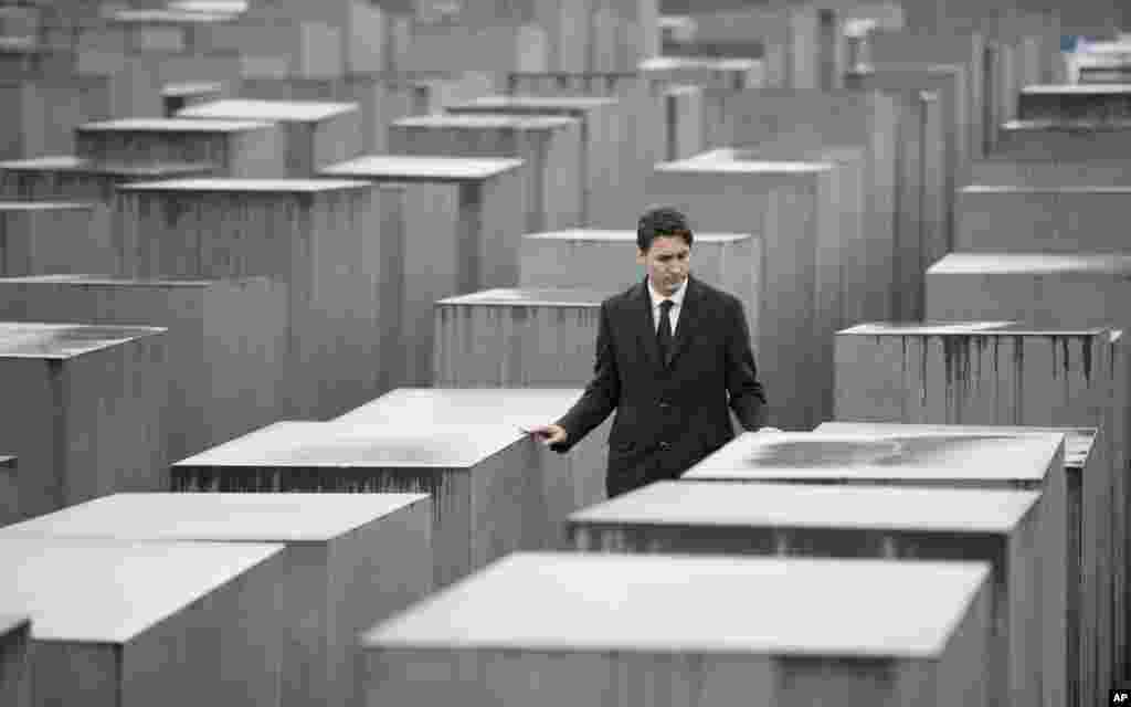 Canada&#39;s Prime Minister Justin Trudeau walks between the concrete slabs of the Holocaust memorial in Berlin during an official visit to Germany.