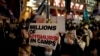 Demonstrators supporting Tibetans, Uyghurs and Hong Kongers march along Regent Street towards the Chinese Embassy in London on October 1, 2021. (Matt Dunham/Associated Press)