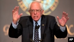 FILE - Democratic presidential candidate Sen. Bernie Sanders, I-Vt., speaks at Georgetown University in Washington. Sanders is a rolling out a plan to slow down the impact of climate change, vowing to cut U.S. carbon emissions, Nov. 19, 2015.