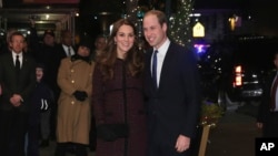 Kate (L), Duchess of Cambridge, and Britain's Prince William arrive at The Carlyle Hotel, Dec. 7, 2014, in New York.