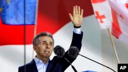 FILE - Billionaire Bidzina Ivanishvili, leader of the Georgian Dream party greets demonstrators during a rally in support of "Russian law" in Tbilisi, Georgia, on April 29, 2024,